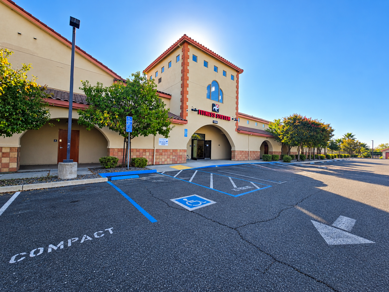 Fitness System building exterior and parking
