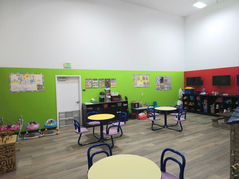 Bright classroom with colorful tables and chairs